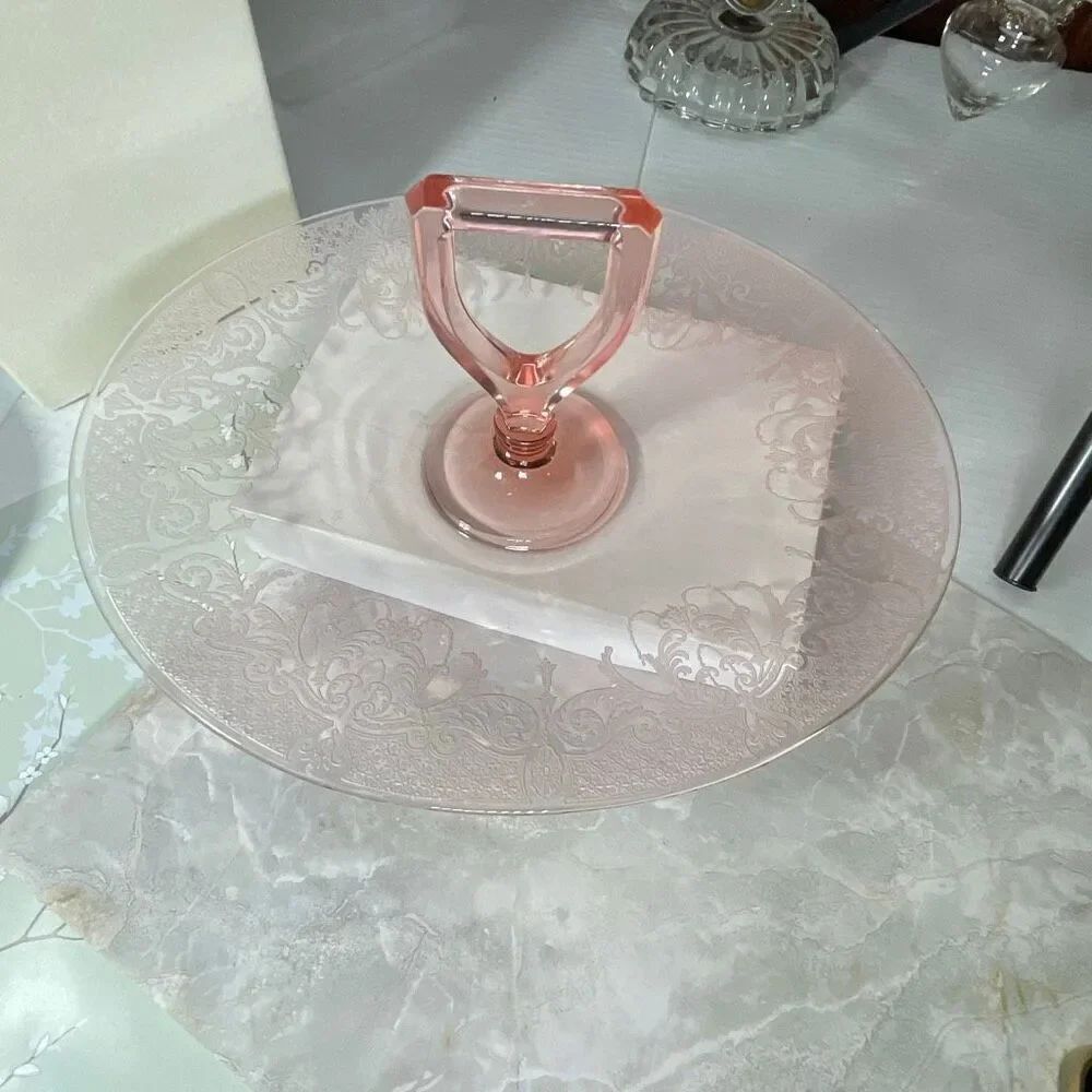 Pink Depression glass etched floral scroll pattern oval platter handle.